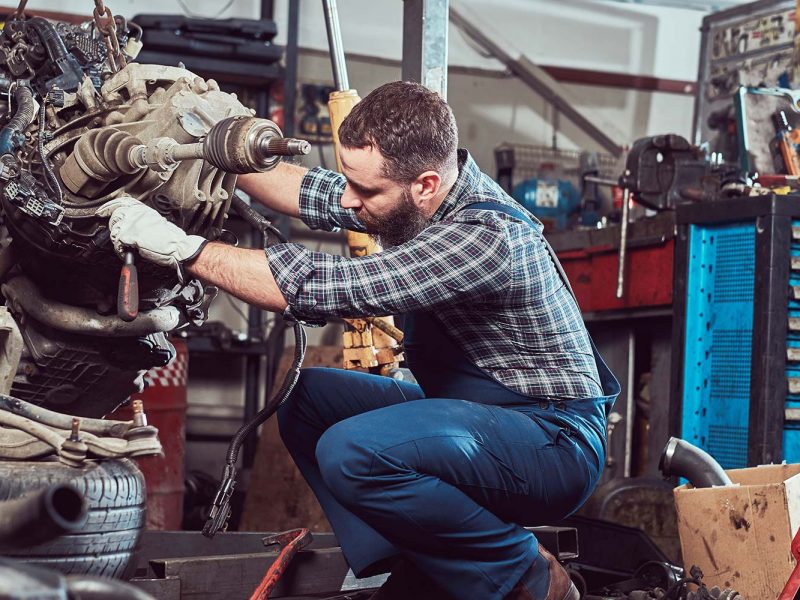 brutal-tattooed-mechanic-repairs-the-car-engine-in-small.jpg